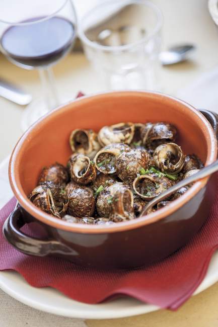 Snails with herb butter — Stock Photo