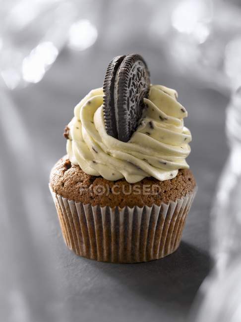 Biscuit cupcake on grey — Stock Photo