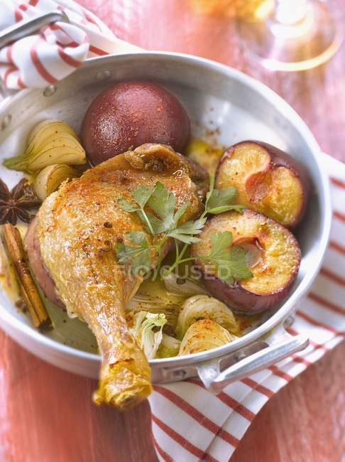 Roasted duck leg with plums and spicies — Stock Photo