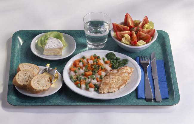 Meal on tray with plates — Stock Photo