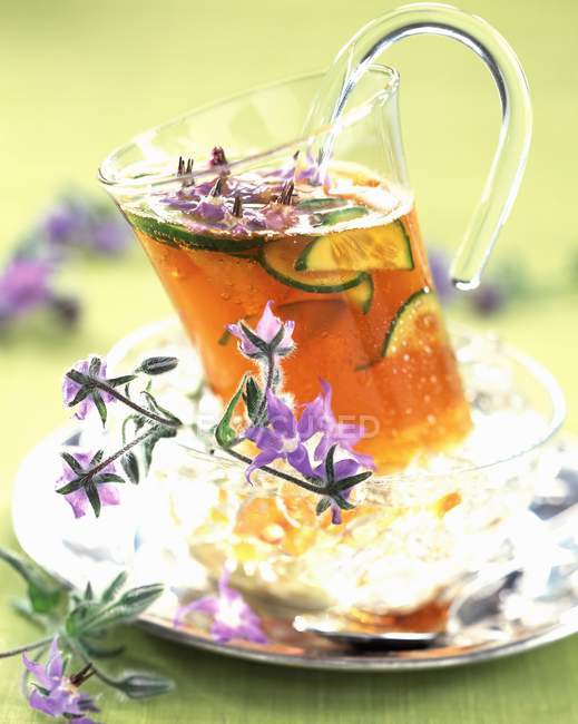 Mug of herbal tea — Stock Photo