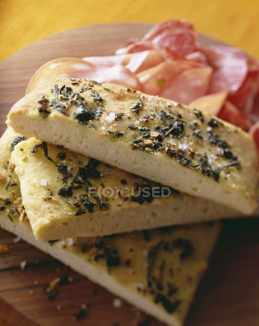 Sliced Focaccia bread with herbs — Stock Photo