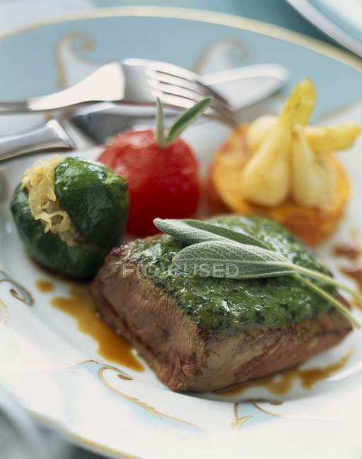 Thick slab of lamb with herbs and vegetables — Stock Photo