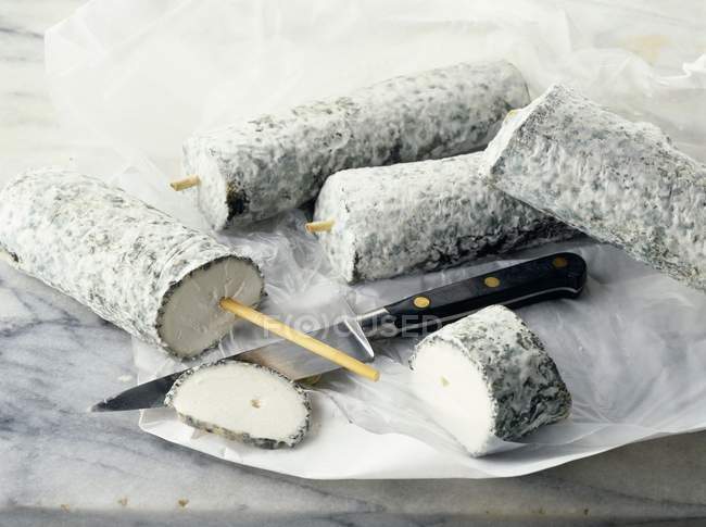Goat cheese on paper — Stock Photo