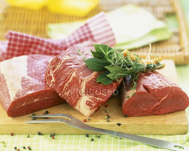 Cut of raw beef with herbs and spices — Stock Photo
