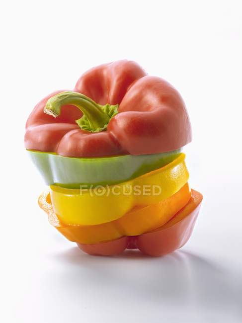 Stacked slices of colorful Bell peppers — Stock Photo