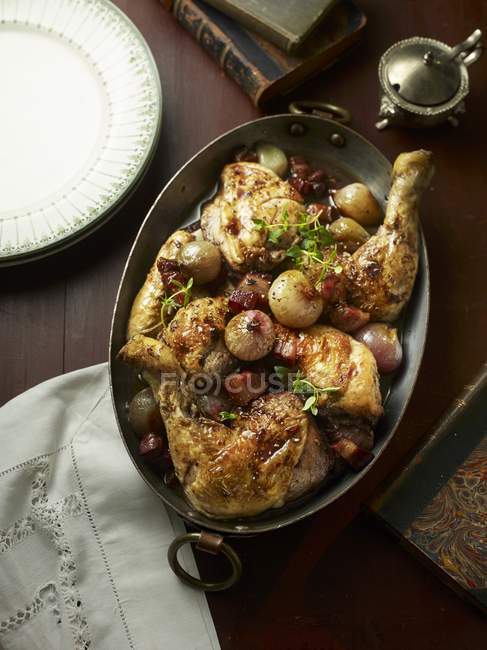 Top view of Coq au vin in a roasting tin — Stock Photo