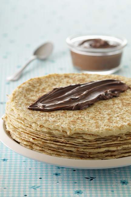 Crepes with chocolate on plate — Stock Photo