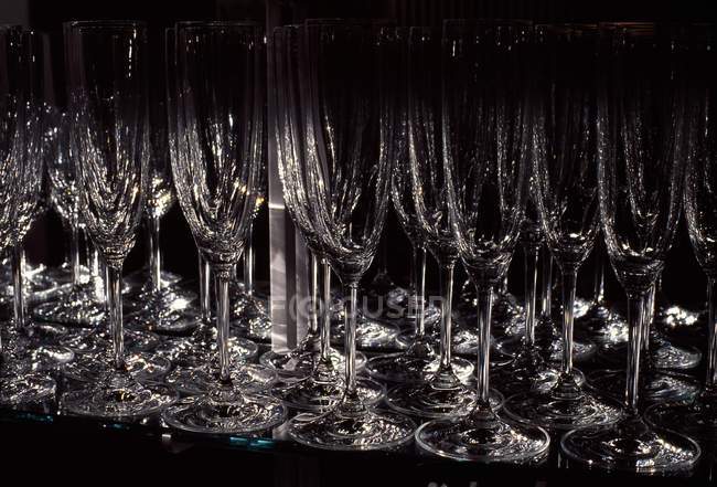 Closeup view of wine glasses stems and bottoms — Stock Photo