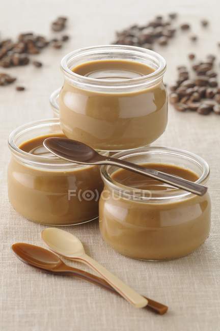 Coffee yogurts in glass jars — Stock Photo