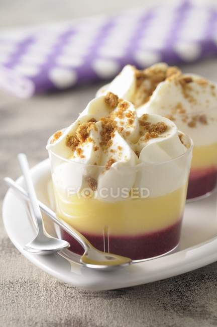 Desserts on plate with spoon — Stock Photo