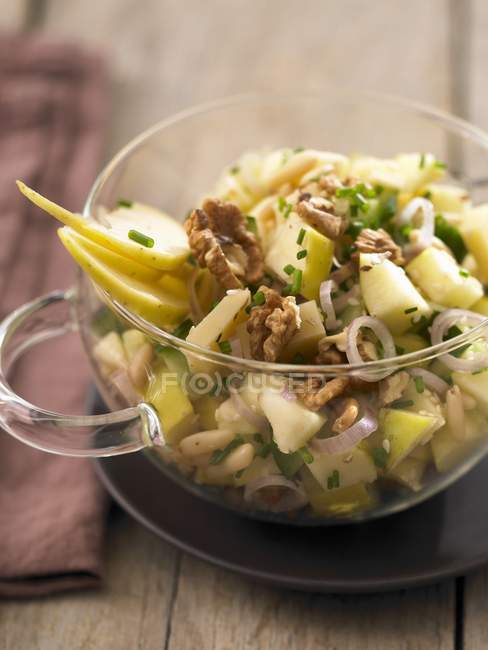 Walnut salad in glass bowl — Stock Photo