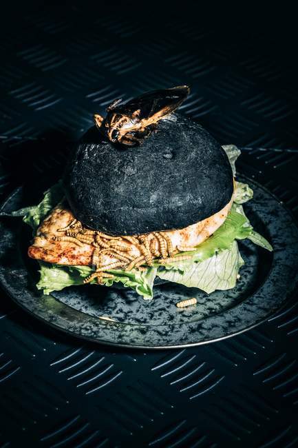Halloween chicken burger with mealworms — Stock Photo