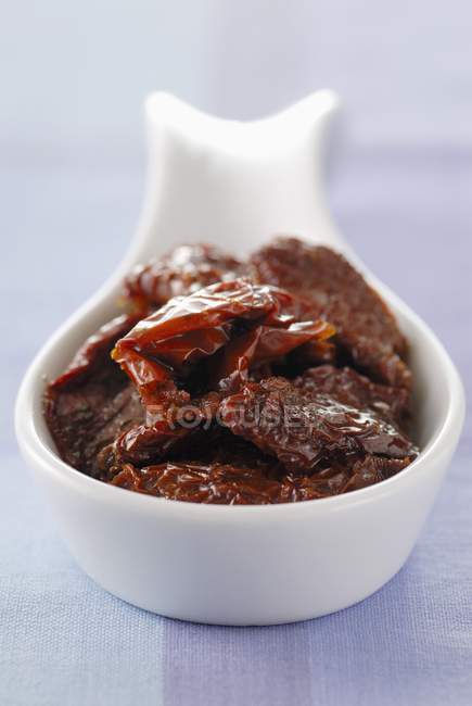 Dried tomatoes in bowl — Stock Photo