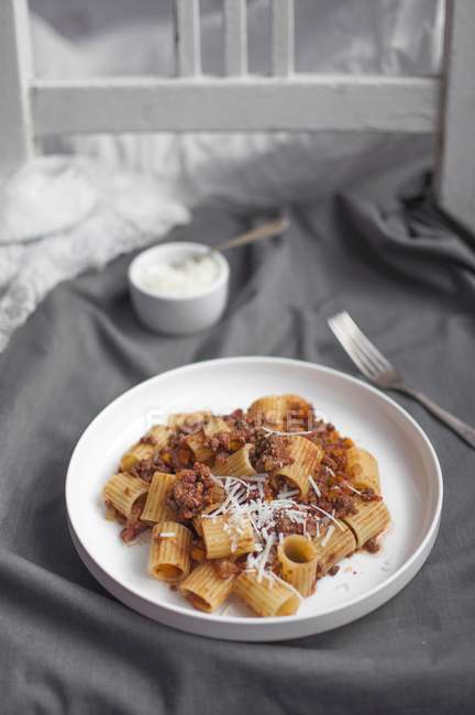 Mezze rigate pasta with bolognese ragu — Stock Photo
