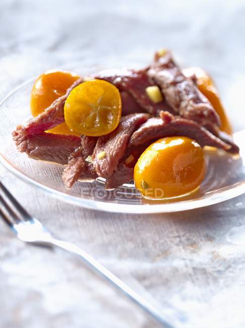 Duck Aiguillettes with kumquats — Stock Photo