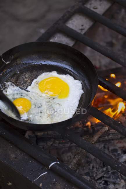 Fried eggs in pan — Stock Photo
