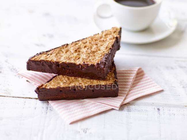 Closeup view of chocolate-coated nut triangles — Stock Photo