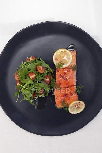 Salmon poached in olive oil — Stock Photo