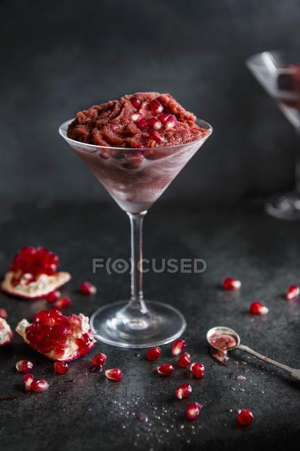 Pomegranate sorbet in a long glass — Stock Photo