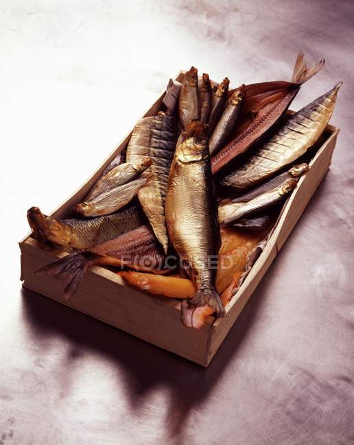 Crate of smoked fish — Stock Photo