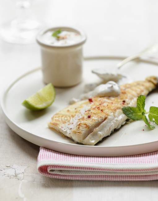 Grilled bass with peppercorns — Stock Photo