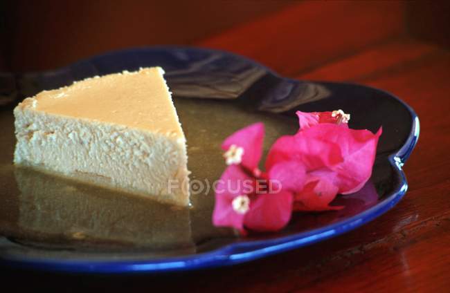 Cheesecake with pineapple coulis — Stock Photo