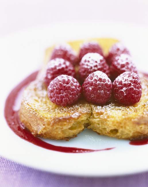 Closeup view of French toast with raspberries on plate — Stock Photo