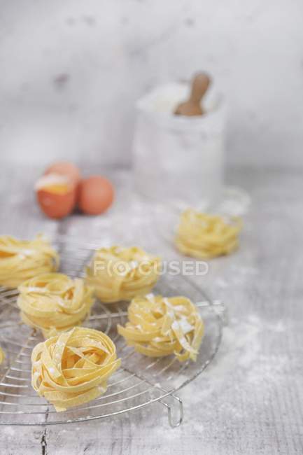 Homemade fettuccine pasta nests — Stock Photo