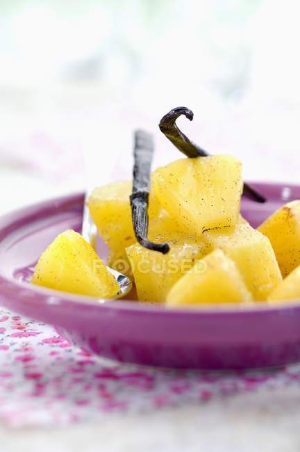 Pineapple with vanilla on plate — Stock Photo
