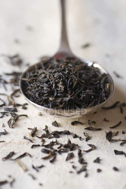 Spoonful of loose black tea — Stock Photo
