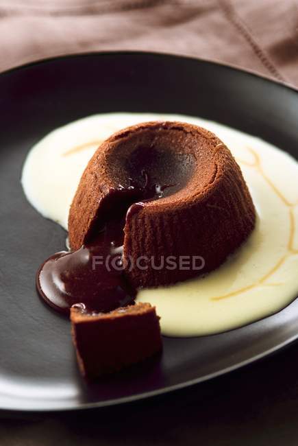 Chocolate fondant with custard — Stock Photo