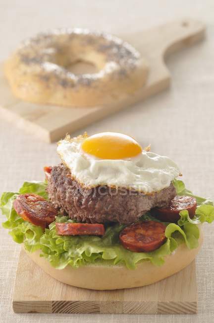 Hamburger with fried egg and Chorizo — Stock Photo