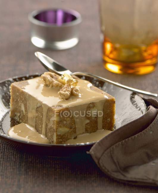 Walnut pudding with sauce — Stock Photo