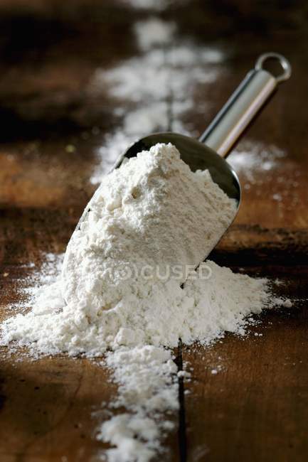 Wheat Flour with scoop — Stock Photo