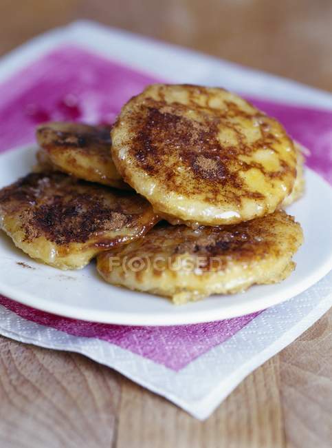 Closeup view of French blinis heap on white plate — Stock Photo