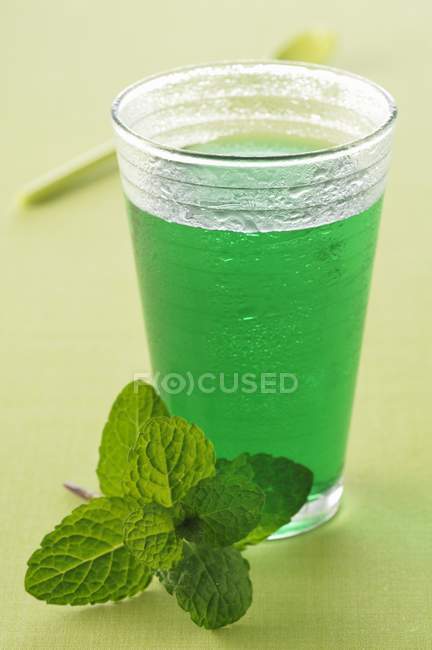 Glass of mint cordial — Stock Photo