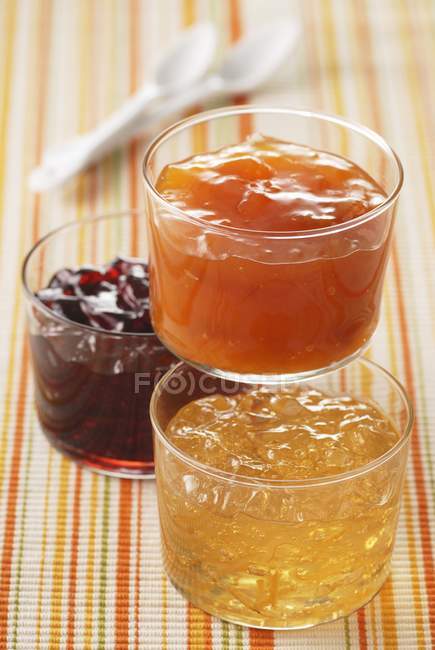 Assorted fruit jams in glasses — Stock Photo