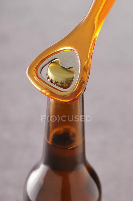 Opening  bottle of beer — Stock Photo