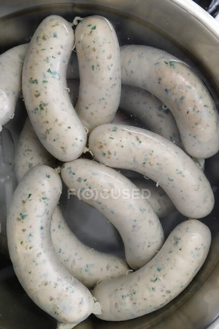 Weisswurst sausages (white sausages) in pan — Stock Photo