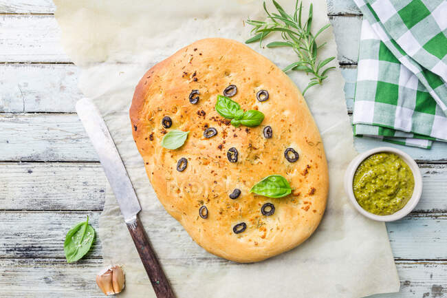 Traditional Italian Focaccia with black olives and rosemary — Stock Photo