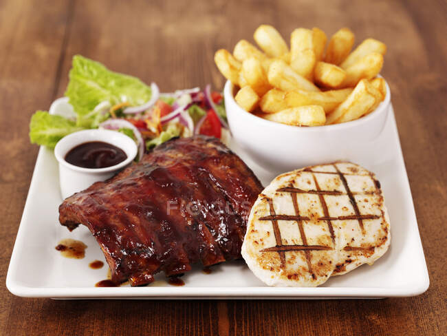 Chicken and Ribs with Chips — Stock Photo