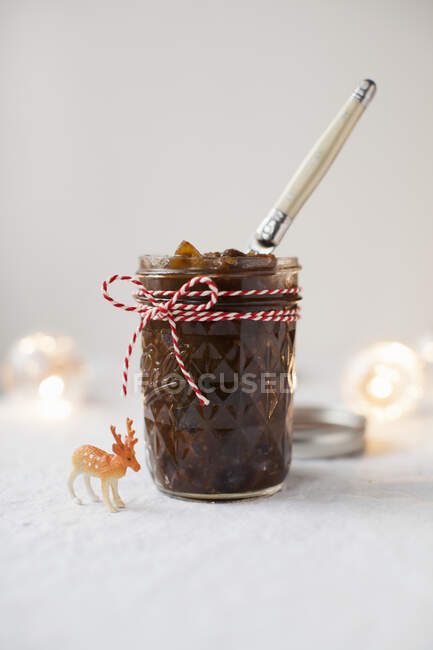 Homemade Christmas chutney in a patterned canning jar — Stock Photo