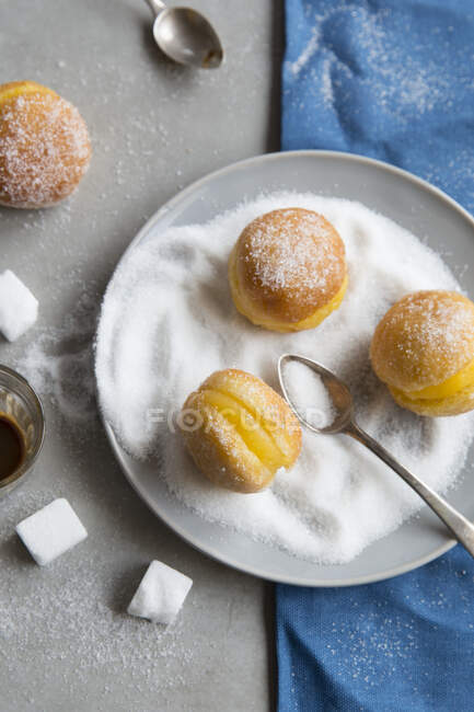 Portuguese donuts with cream fillings and sugar — Stock Photo