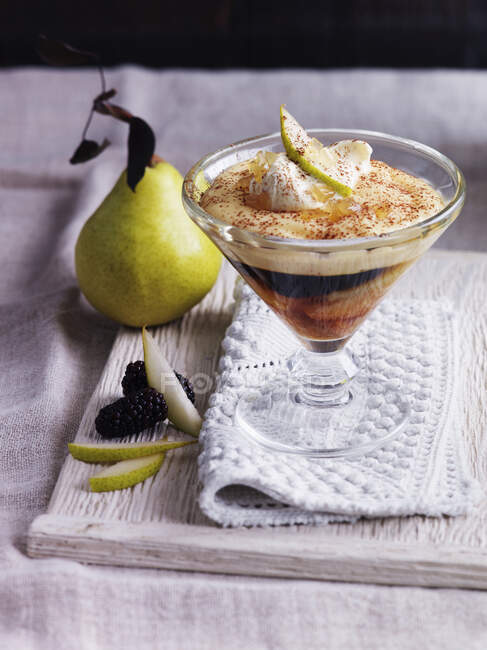 Trifle with pears, cream, blackberries and custard — Stock Photo