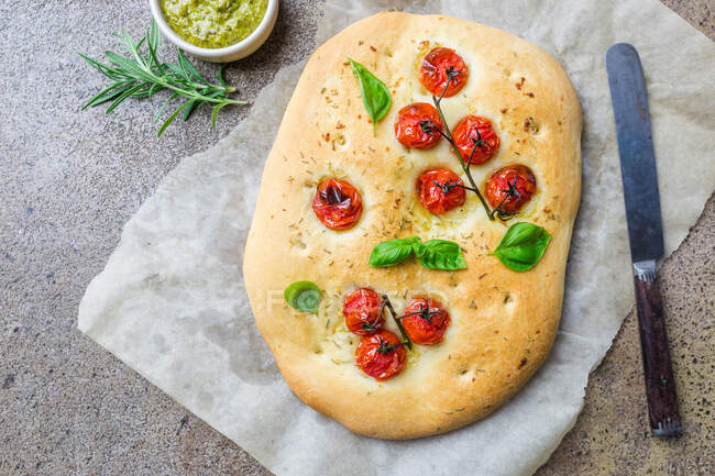 Traditional Italian Focaccia with tomatoes and rosemary — Stock Photo