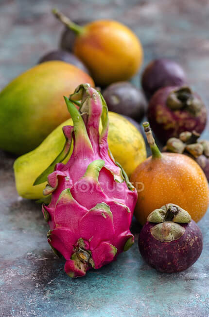 Fresh mangosteen fruits on wooden background — Stock Photo