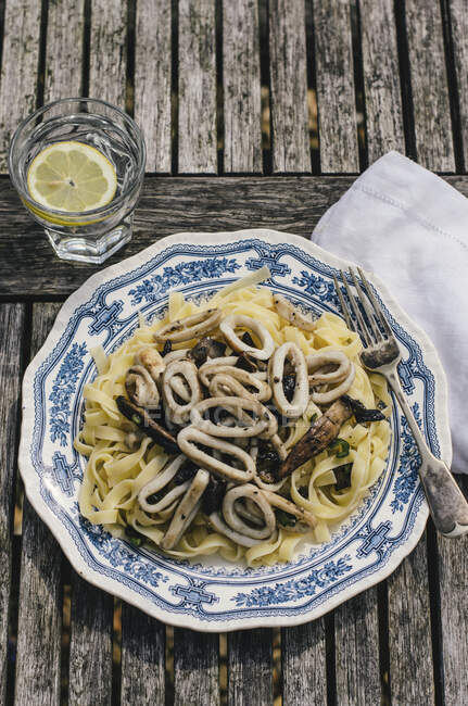 Squid pasta in vintage bowl — Stock Photo