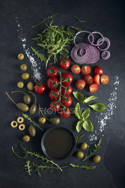 Salad ingriedients with sea salt and olive oil — Stock Photo