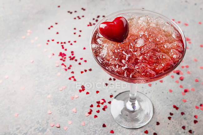 Fresh red margarita cocktail with hearts — Stock Photo